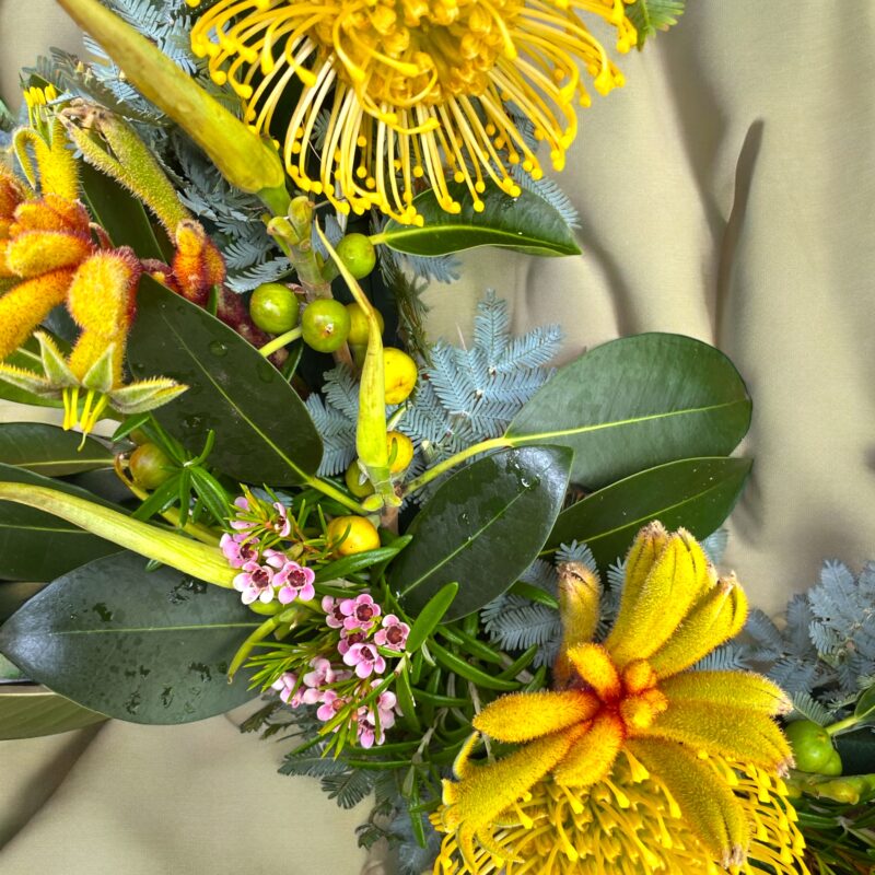 Close up picture of the australian wreath flowers and greenery