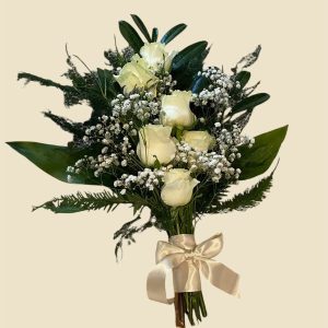 Picture of sheath with green foilage, white roses, baby's breath dainty flowers with satin ribbon to match